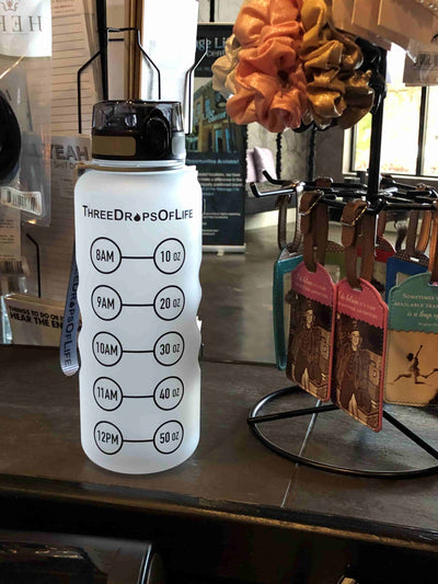 50oz BPA-free Tritan water bottle with measurement markings on a countertop
